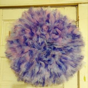 14in matte and glitter. Tulle Wreath color pink,purple, and white.